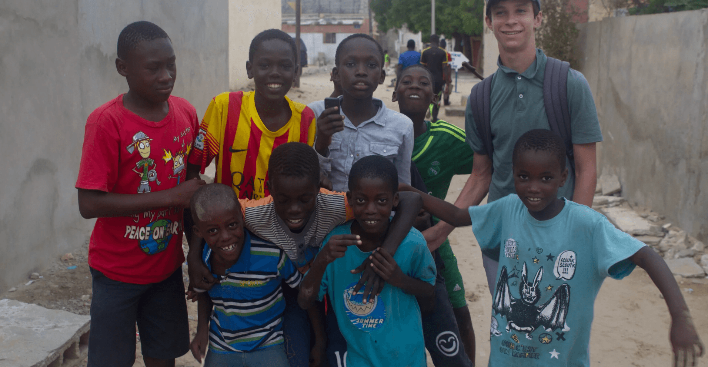 Alec Katz alongside several Senegalese Talibes, who are part of the community Soles4Good serves.